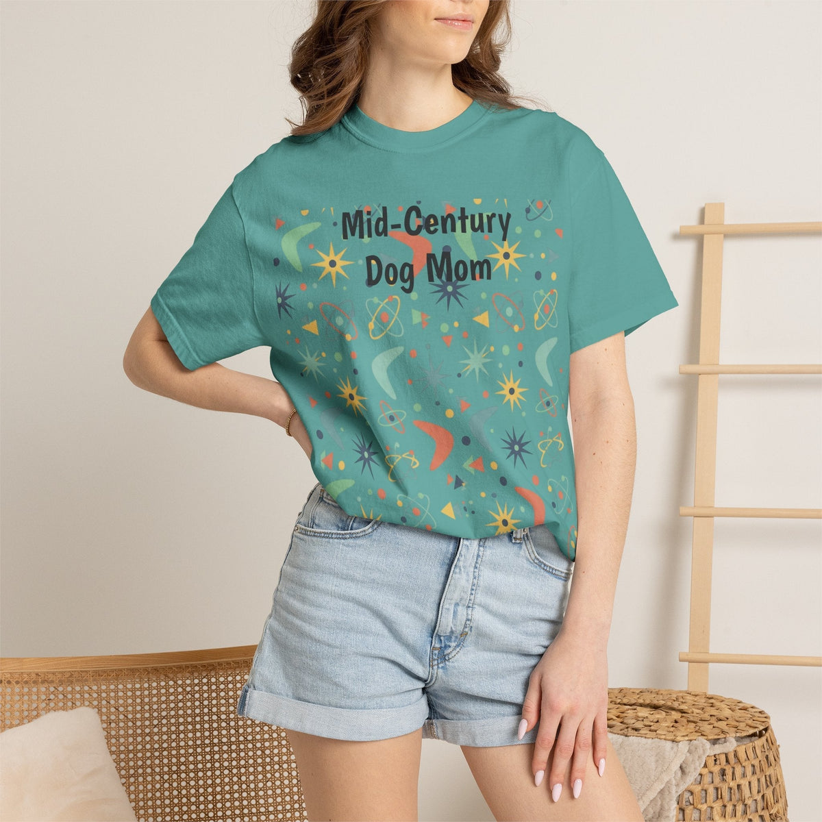 Paws And Printables teal cotton t-shirt featuring a retro mid-century atomic star and boomerang pattern for dog moms.