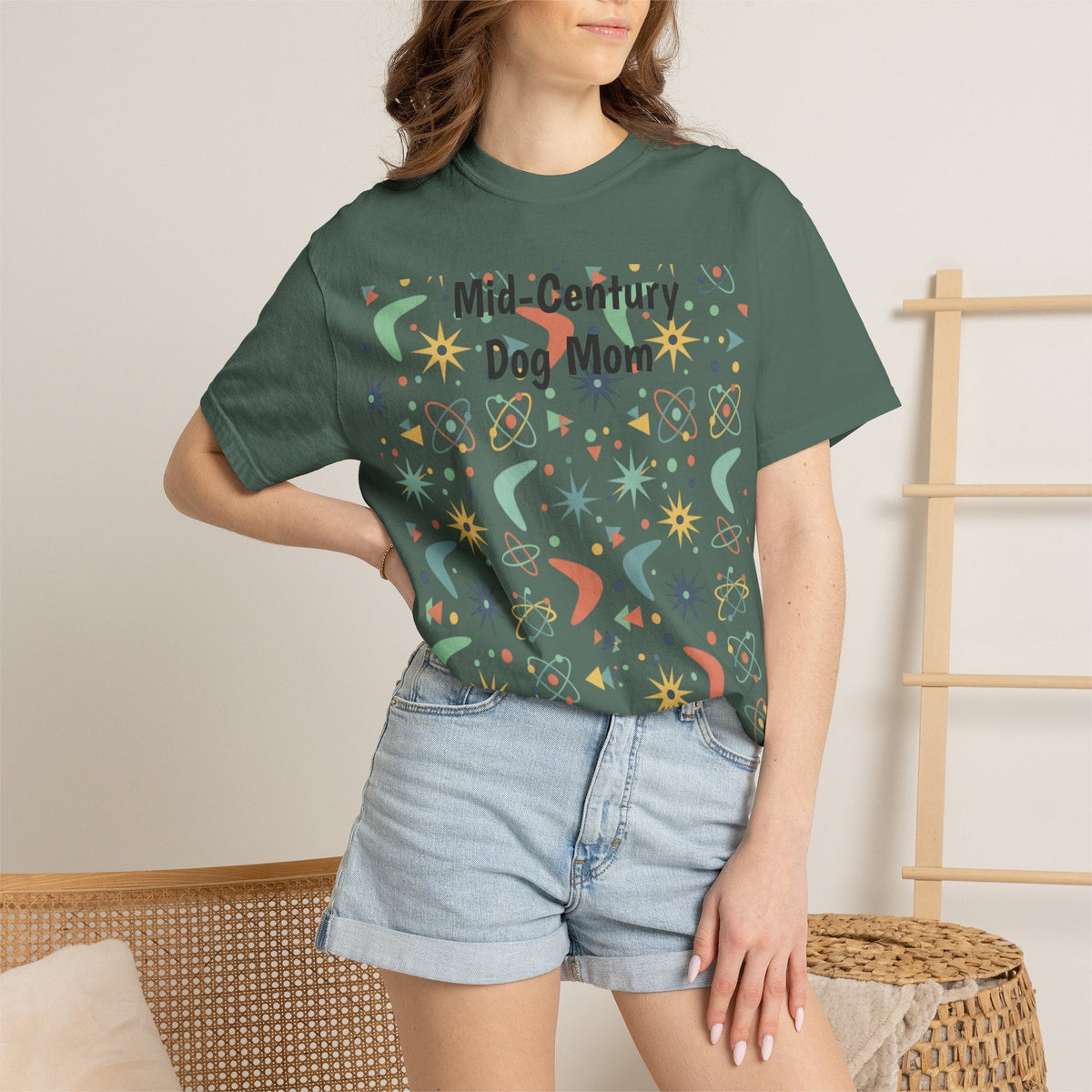 Paws And Printables dark green cotton t-shirt featuring a retro mid-century atomic star and boomerang print.
